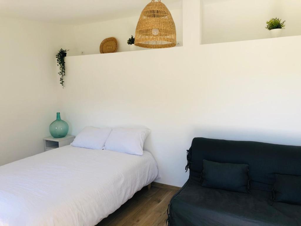Postel nebo postele na pokoji v ubytování Le Cabanon
