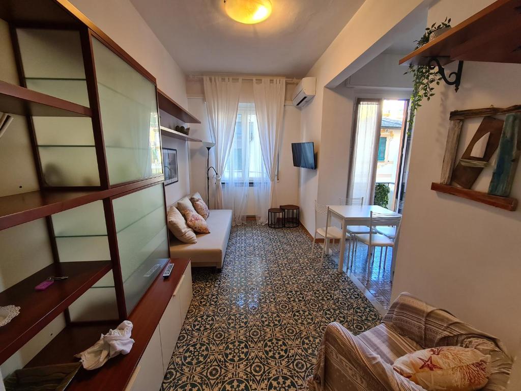 a living room with a couch and a table at Casa Della Paola by PortofinoVacanze in Santa Margherita Ligure
