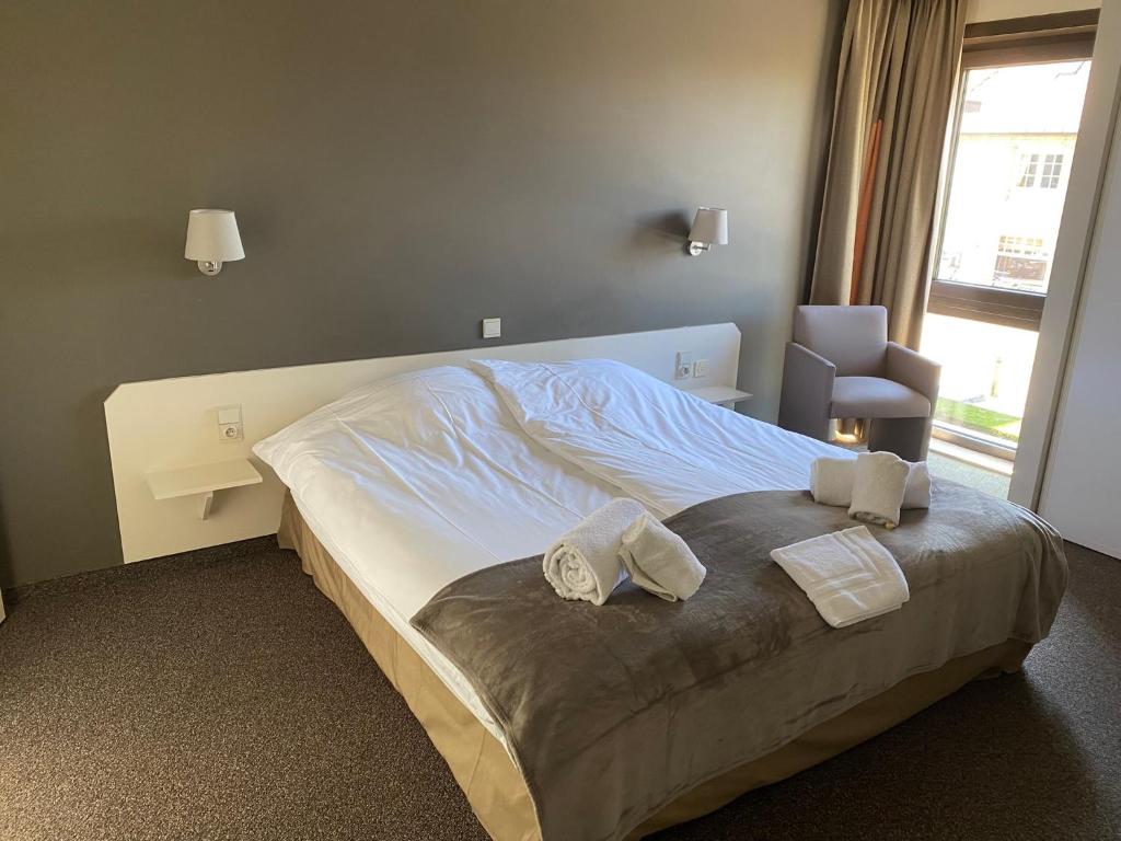 Postel nebo postele na pokoji v ubytování Hotel de Vaart