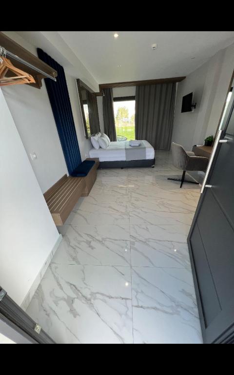 Posteľ alebo postele v izbe v ubytovaní V luxury Suites