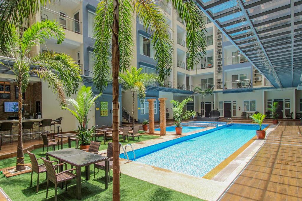 an image of the courtyard of a building with a swimming pool at La Grande Residence- Grand Studio in Angeles