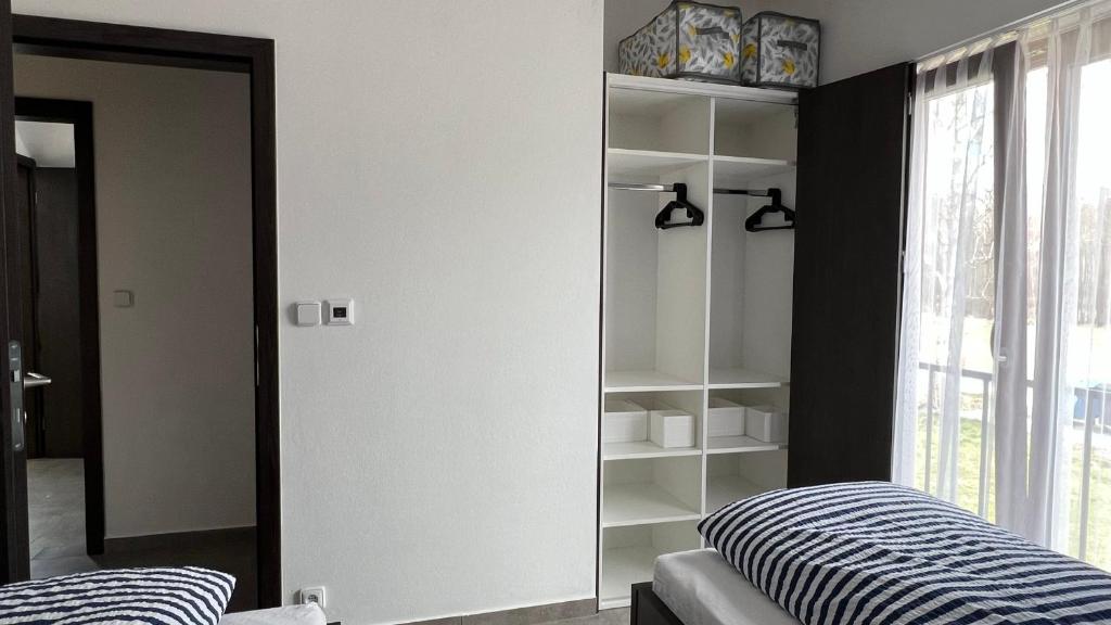 Postel nebo postele na pokoji v ubytování Apartmán D5 Nová Pec