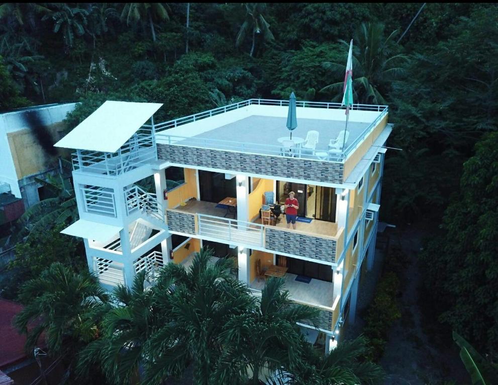an overhead view of a house with a swimming pool at The Blue Pagong in Puerto Galera