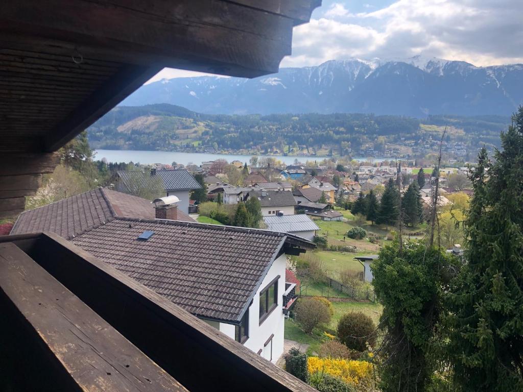 a view of a town with a lake and mountains at Haus Alpenrose in Seeboden