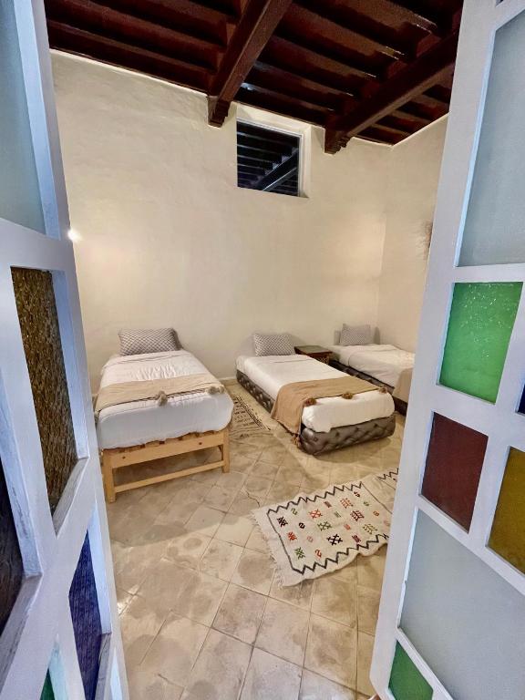 Postel nebo postele na pokoji v ubytování Riad Dar Zayna