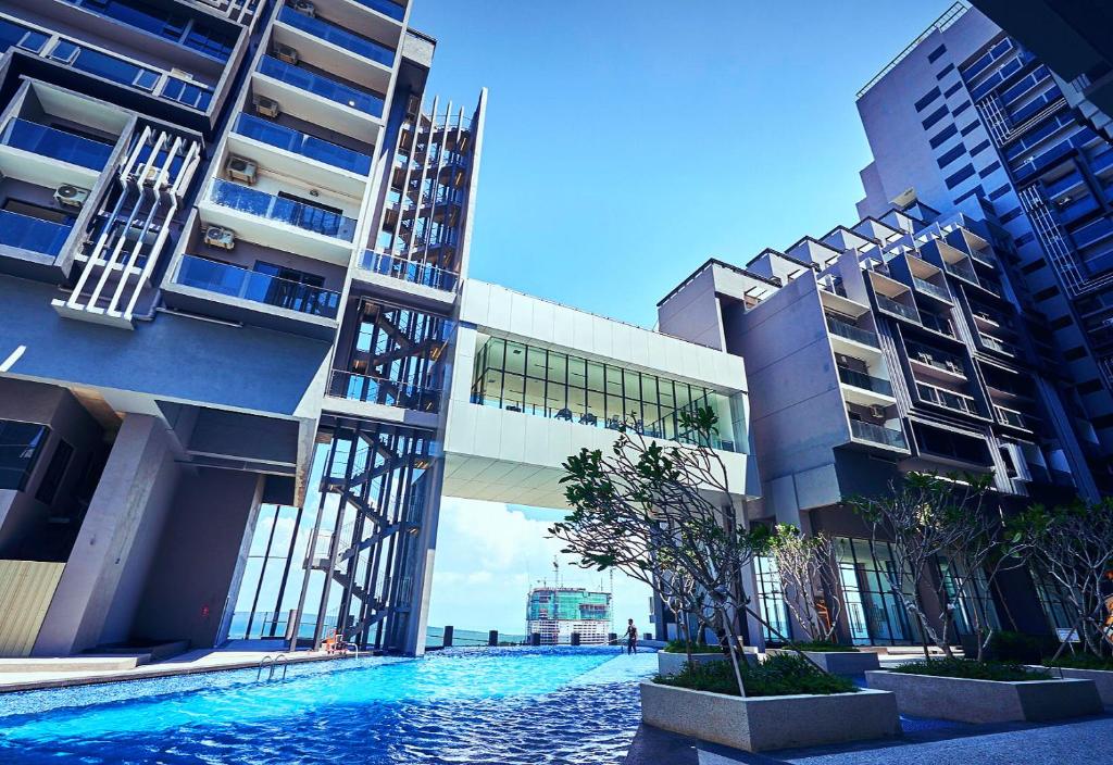 a swimming pool in the middle of a building at Imperio Residences Melaka Malacca in Melaka