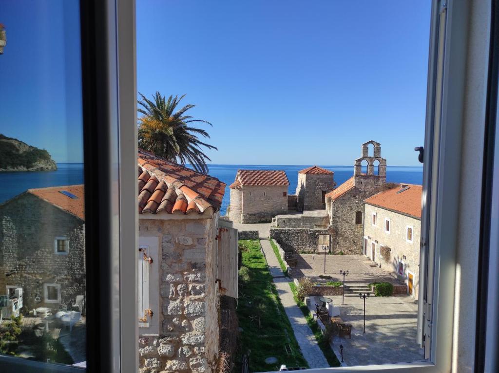 a view of a city from a window at FREEDOM HOSTEL in Budva