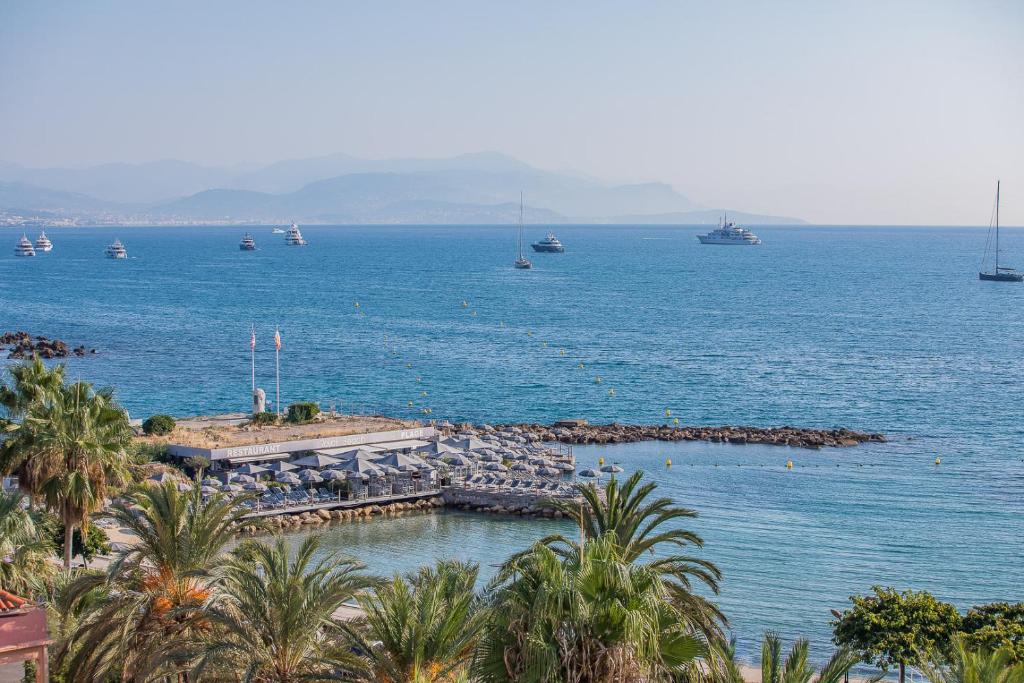 a view of a large body of water with boats at Royal Antibes - Luxury Hotel, Résidence, Beach & Spa in Antibes