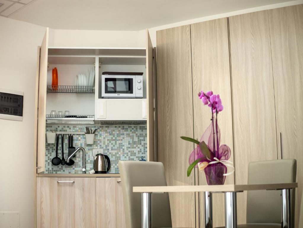 A kitchen or kitchenette at Ego' Residence Ferrara
