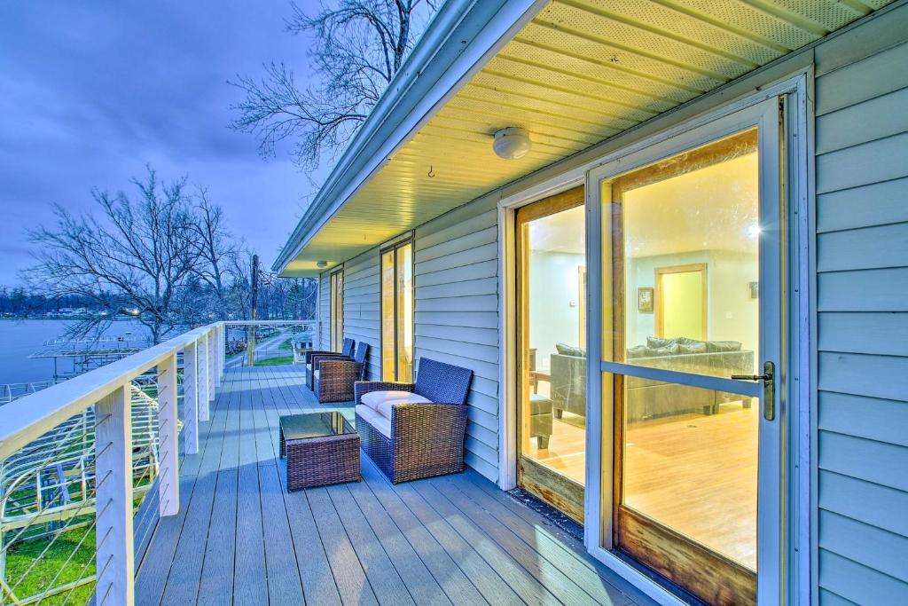 a porch with a couch and chairs on a house at Honeoye Lake House with Community Amenities! in Honeoye