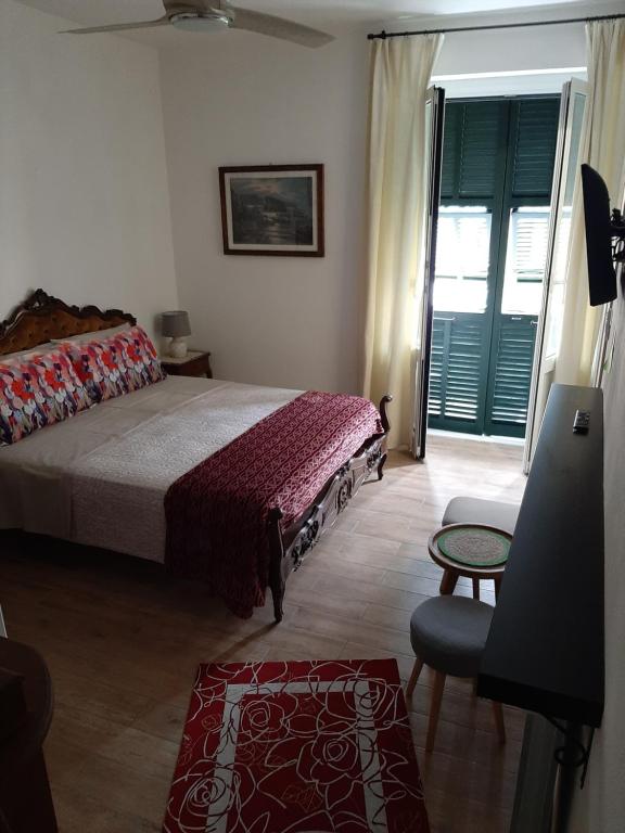Postel nebo postele na pokoji v ubytování Retro' BeB