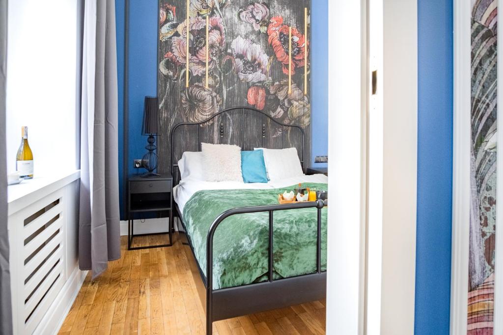 Posteľ alebo postele v izbe v ubytovaní AT Krakow Apartments
