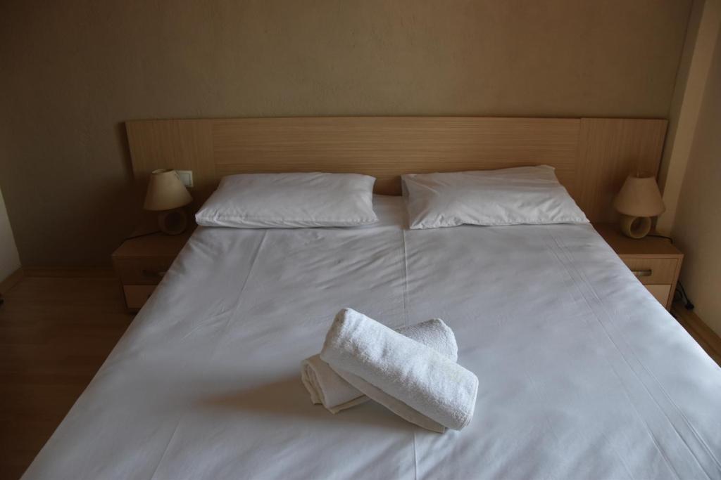 Postel nebo postele na pokoji v ubytování Brezza Marina House