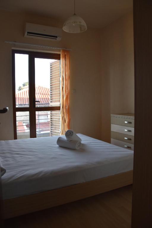 Postel nebo postele na pokoji v ubytování Brezza Marina House