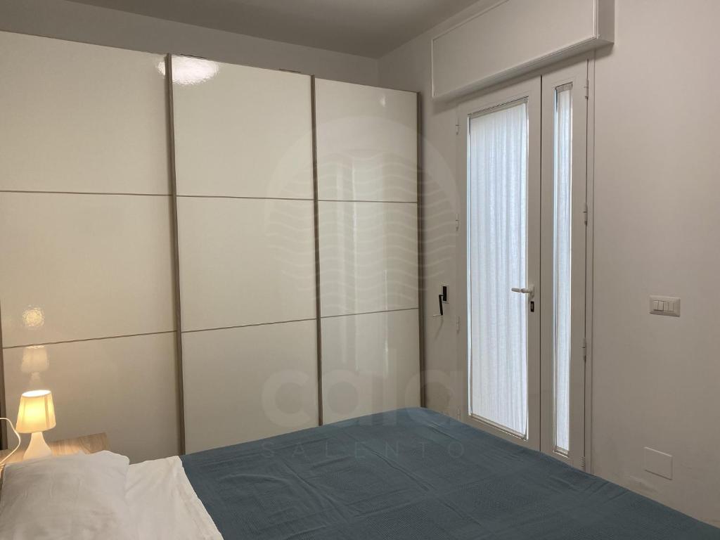 Postel nebo postele na pokoji v ubytování Villa Grace By Cala Salento