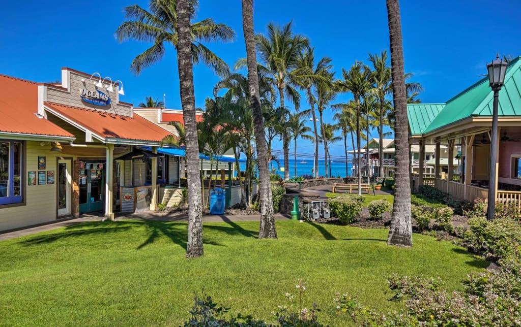 a resort with palm trees and the ocean in the background at GARDEN VIEW STUDIO - KONA ISLANDER INN CONDOS condo in Kailua-Kona