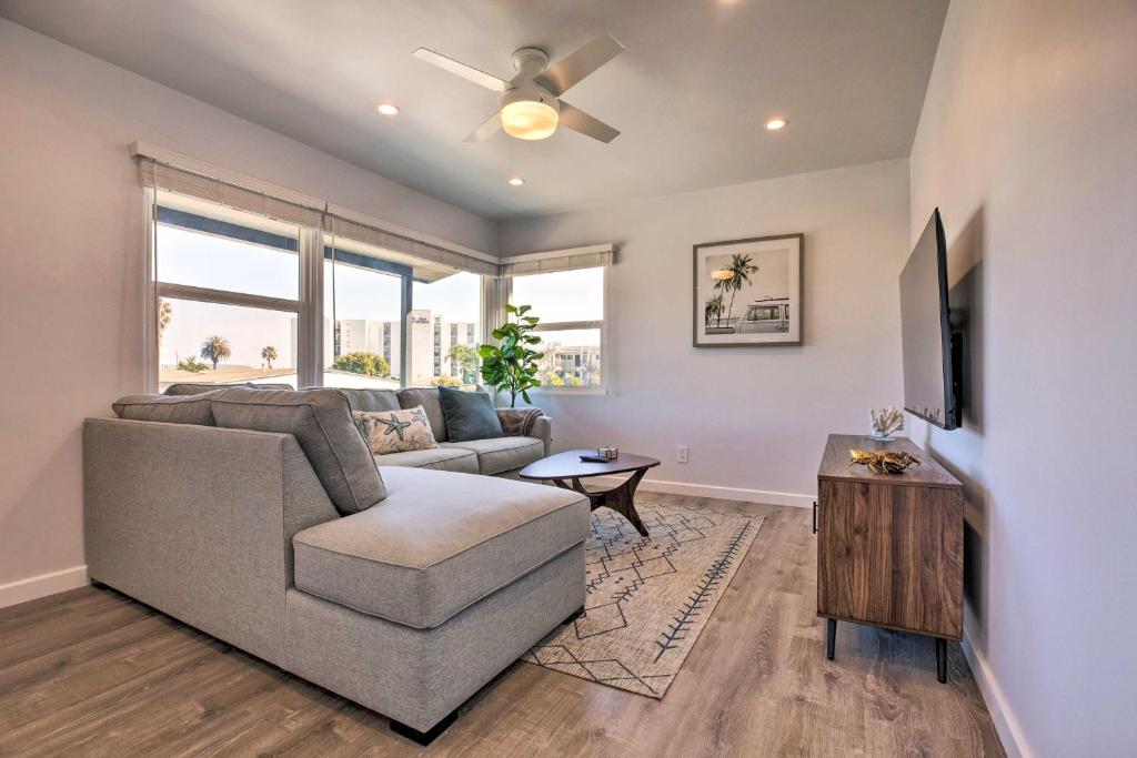 a living room with a couch and a tv at Charming San Diego Apartment - Walk to Bay! in San Diego