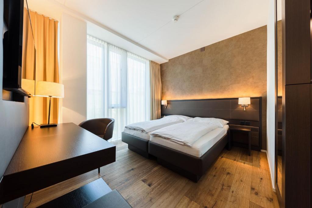 Postel nebo postele na pokoji v ubytování Hotel kommod