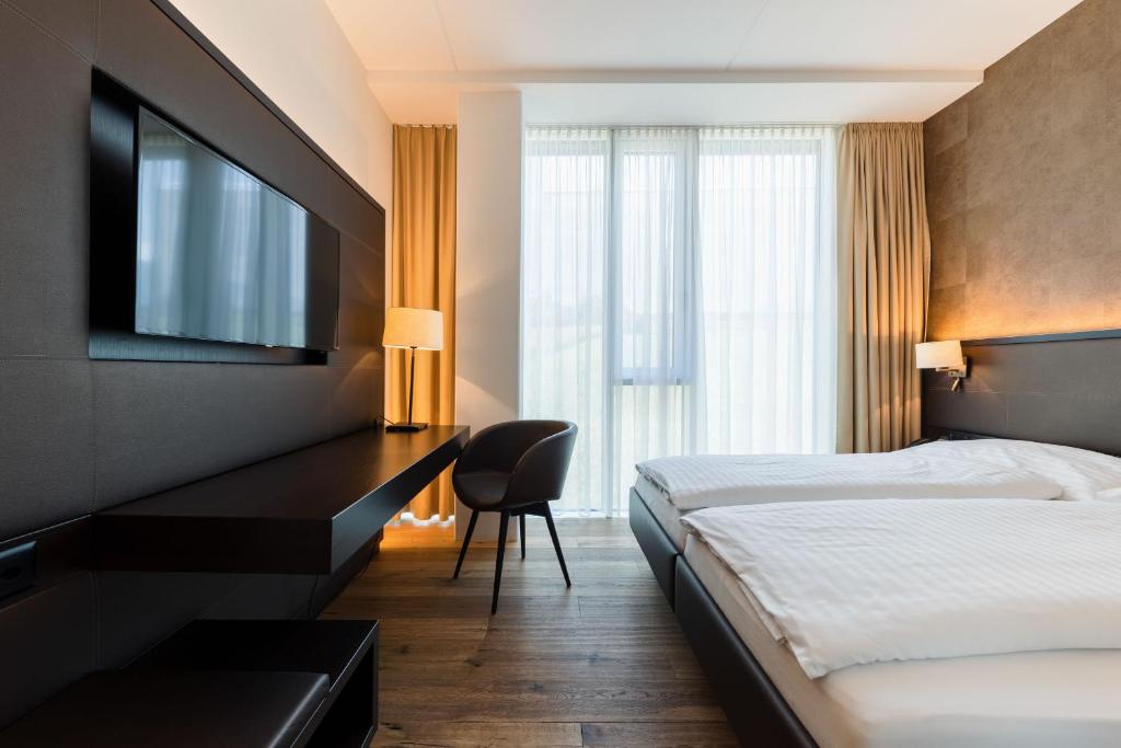 Postel nebo postele na pokoji v ubytování Hotel kommod