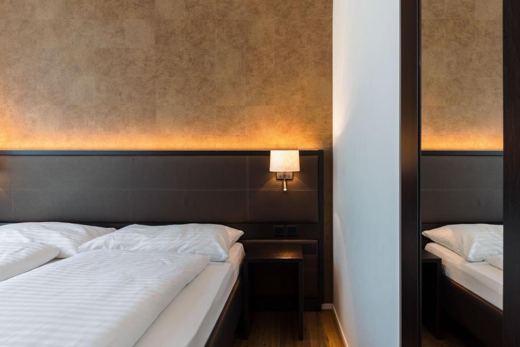 Postel nebo postele na pokoji v ubytování Hotel kommod