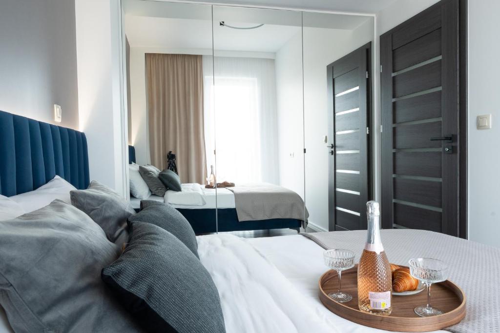 Posteľ alebo postele v izbe v ubytovaní Apartamenty DES-Zator