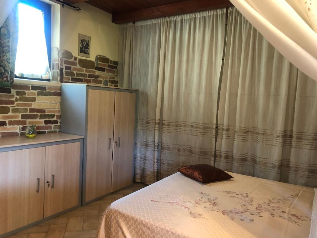 Postel nebo postele na pokoji v ubytování Dependance con vista mare