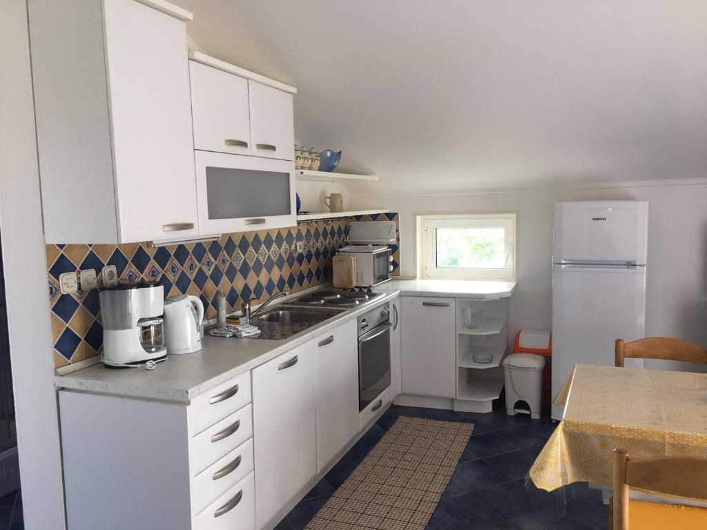 Kuchyň nebo kuchyňský kout v ubytování Apartments Mikelic