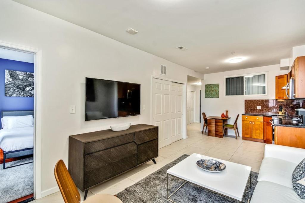 a living room with a couch and a tv at The Vacationers place in Philadelphia