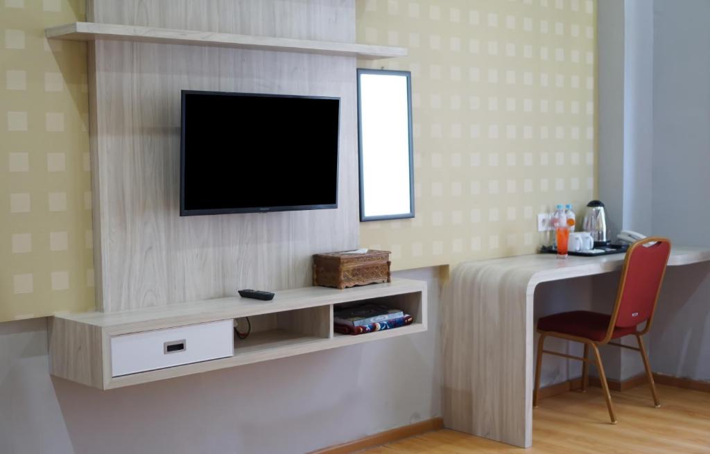 TV a/nebo společenská místnost v ubytování UNP Hotel & Convention