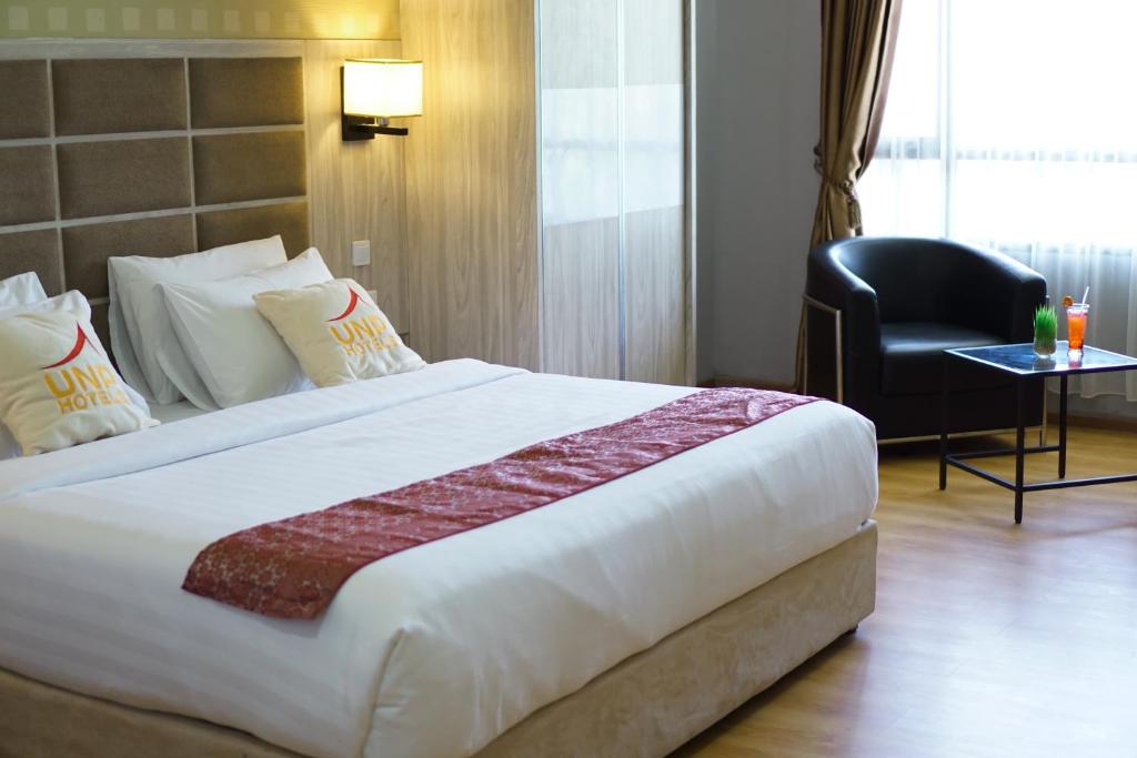 Postel nebo postele na pokoji v ubytování UNP Hotel & Convention