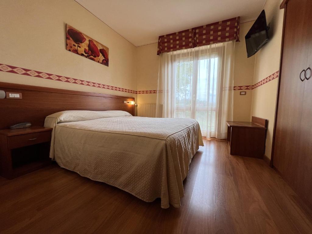 Postel nebo postele na pokoji v ubytování Viole Country Hotel