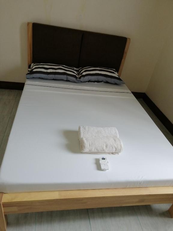 Postel nebo postele na pokoji v ubytování Walkerz Inn