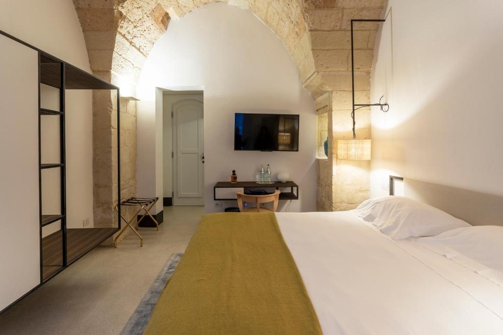 Postel nebo postele na pokoji v ubytování Palazzo De Noha - Boutique Hotel