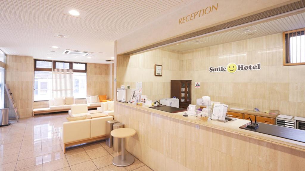 a waiting room at a smile hospital with a counter at Smile Hotel Sugamo in Tokyo