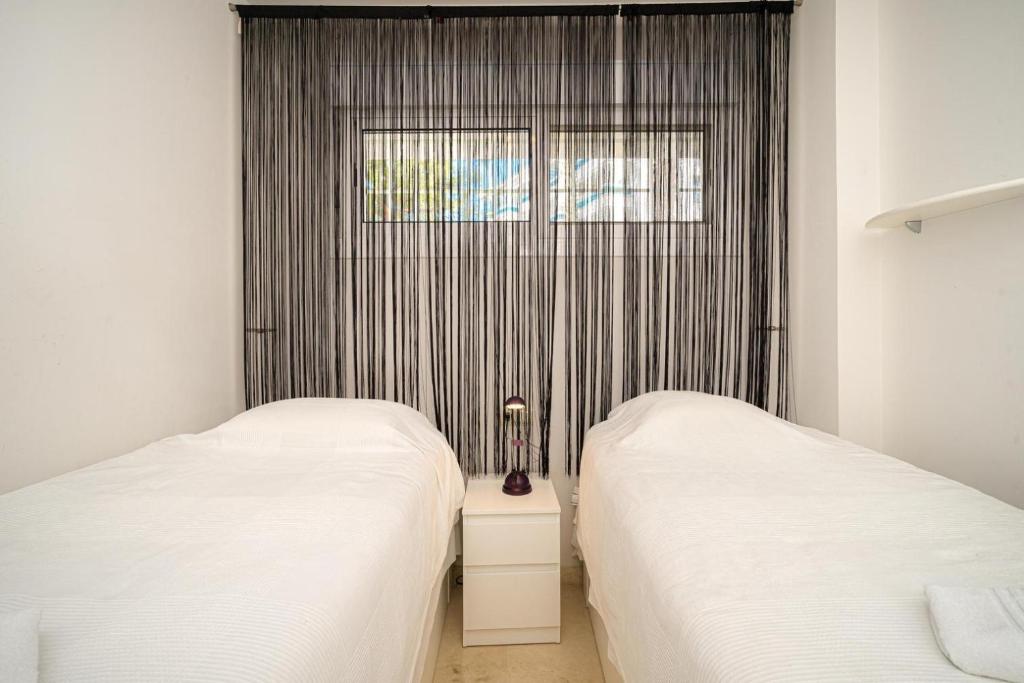 A bed or beds in a room at Estrella 23BH