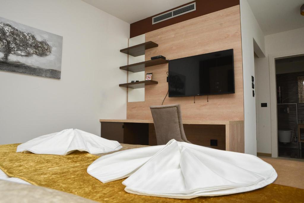 a room with a table with two white objects on it at Hotel Meduza in Senj