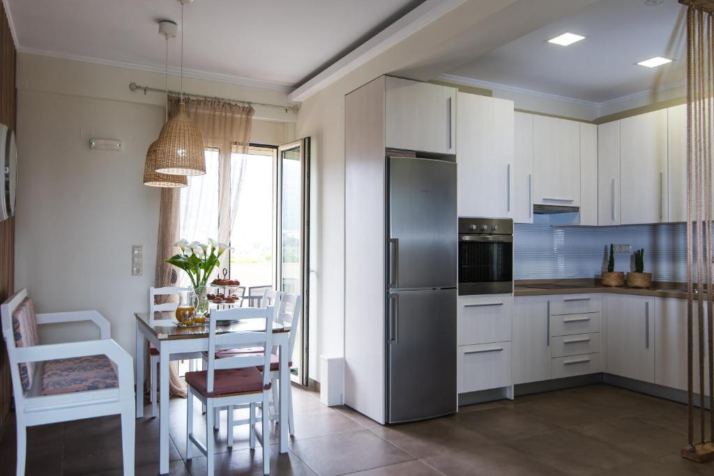 Kuchyňa alebo kuchynka v ubytovaní Alkinoos Apartment