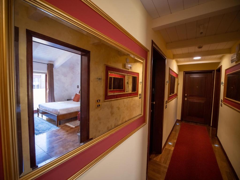 A bed or beds in a room at Ego' Residence Ferrara