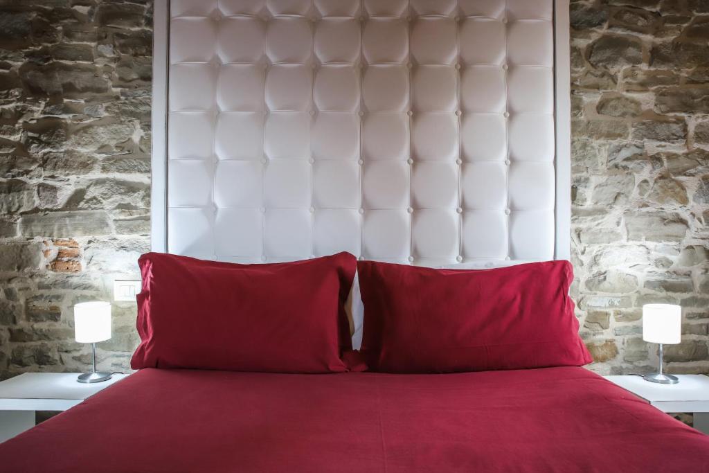 Postel nebo postele na pokoji v ubytování Albergo del Bramante