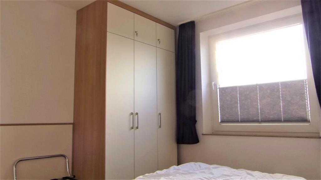 Postel nebo postele na pokoji v ubytování Haus Horizont Fewo Nr. 4
