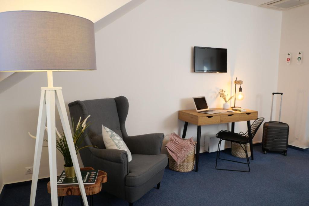 TV a/nebo společenská místnost v ubytování Hotel Baroko