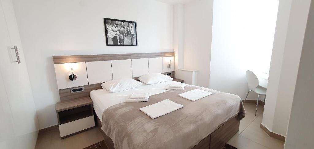 Postel nebo postele na pokoji v ubytování Apartments Lofiel