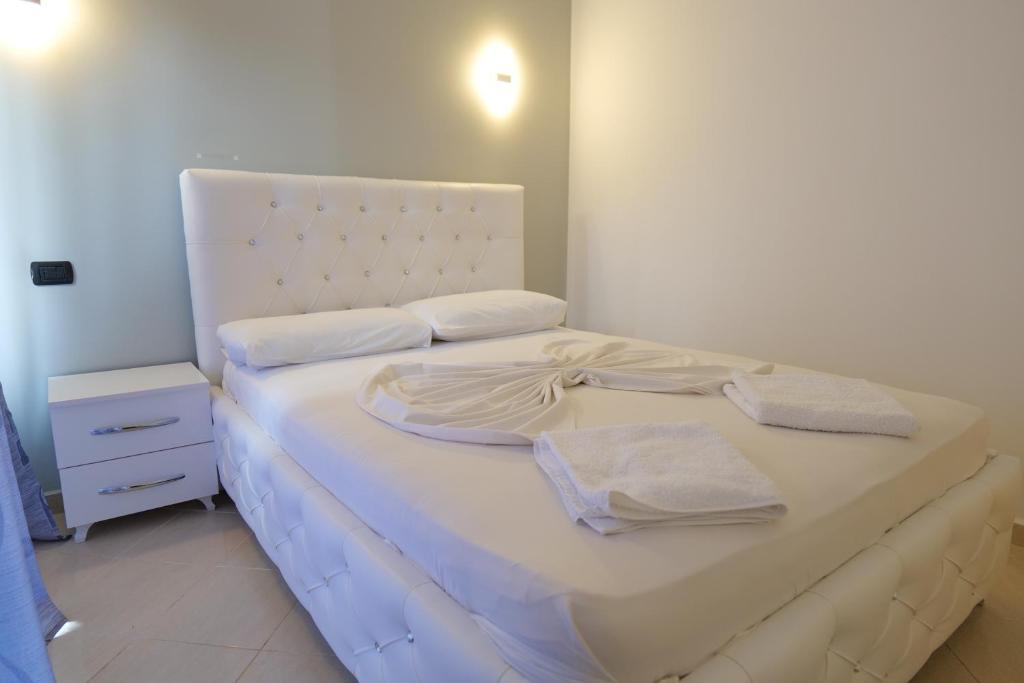 Postel nebo postele na pokoji v ubytování Hotel Dior