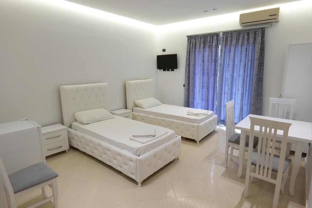 Postel nebo postele na pokoji v ubytování Hotel Dior