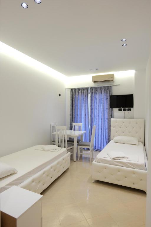 Postel nebo postele na pokoji v ubytování Hotel Dior
