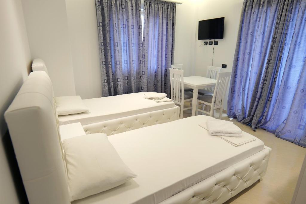 Postel nebo postele na pokoji v ubytování Hotel Dior