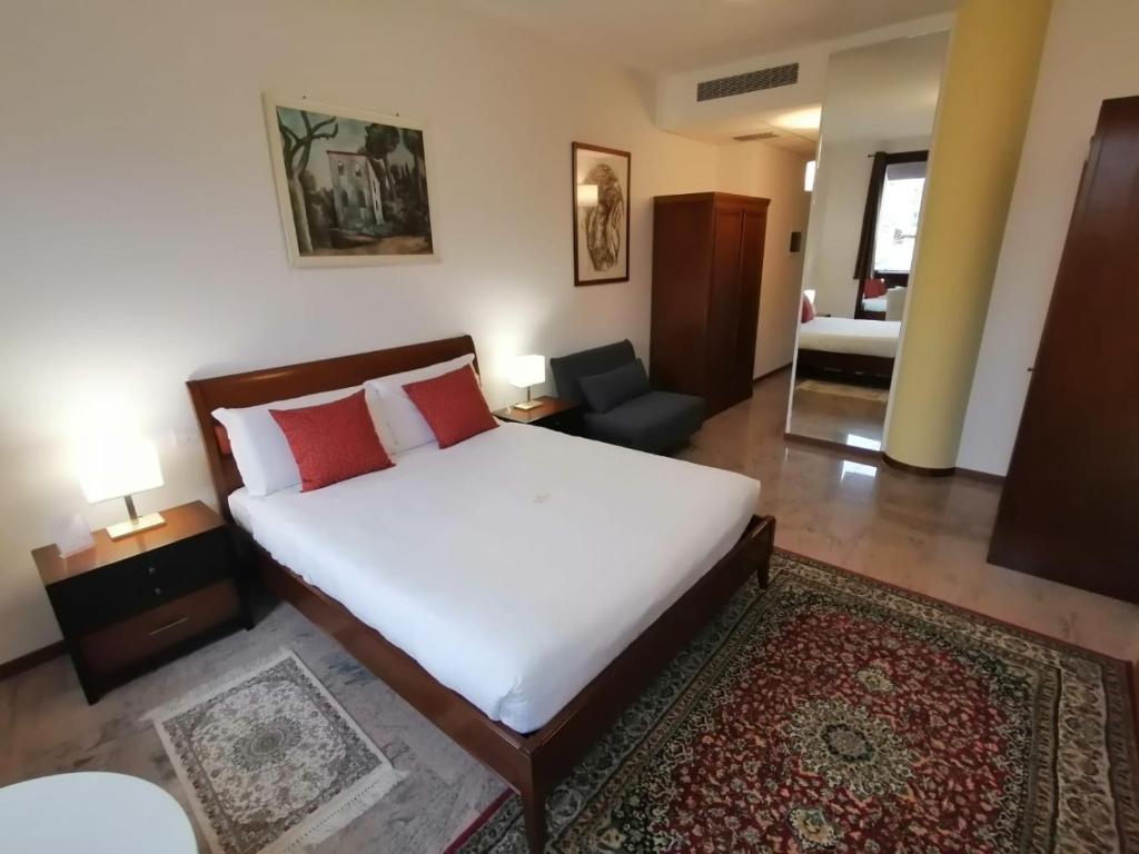 A bed or beds in a room at Ego' Residence Ferrara