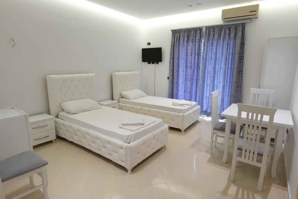 Postel nebo postele na pokoji v ubytování Hotel Dior