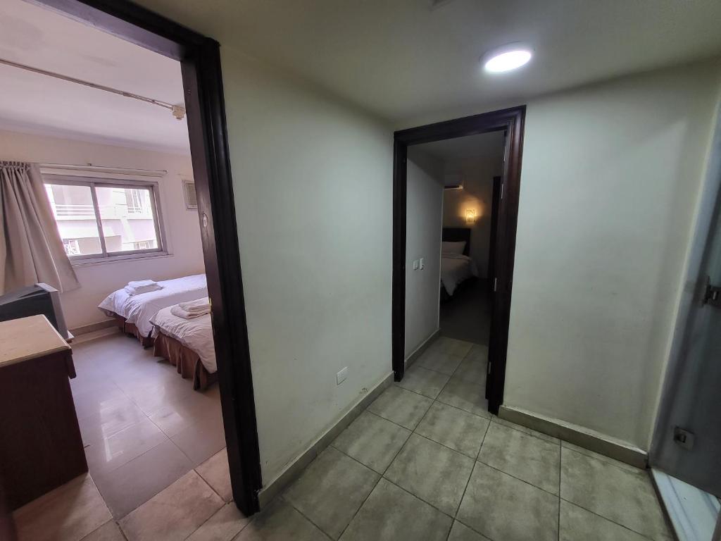 Postel nebo postele na pokoji v ubytování Regency Hotel