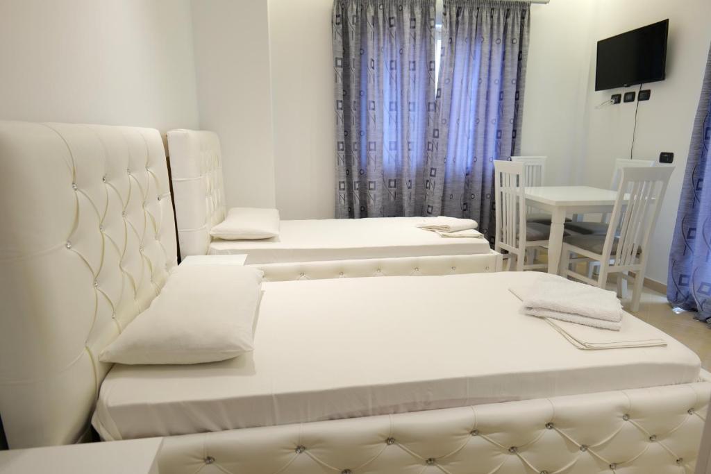 Postel nebo postele na pokoji v ubytování Hotel Dior